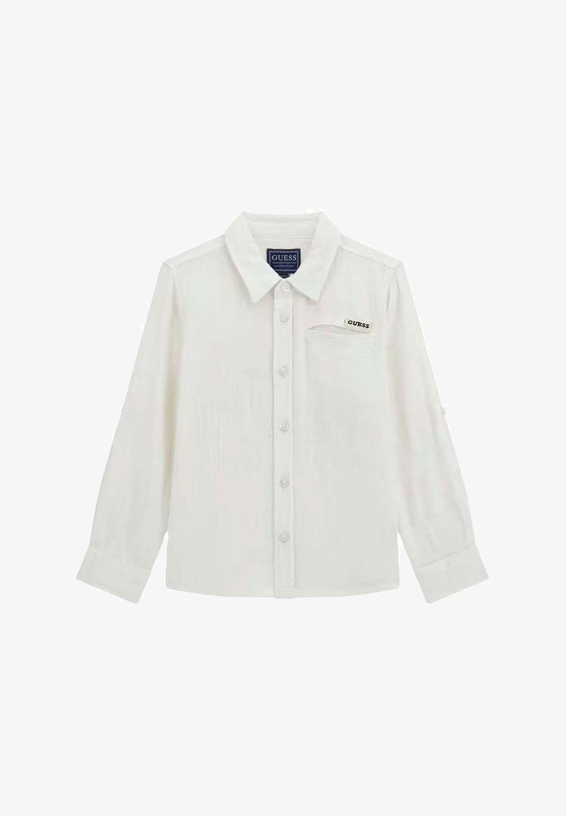 Camicia bianca a maniche lunghe con colletto, dotata di un piccolo logo ricamato sulla tasca e tessuto testurizzato.