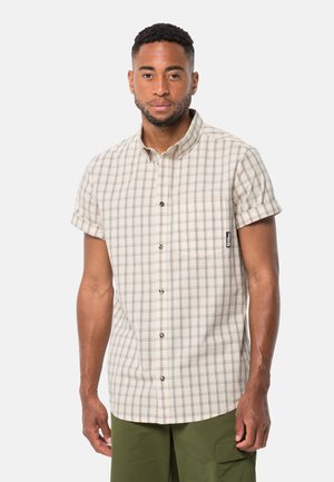 Korte mouwen overhemd in beige met een geruit patroon van bruine en zwarte lijnen; heeft een voorzak en een gestikte labeldetail.