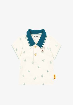 Polo shirt in cream cotton with teal collar, featuring small dinosaur patterns and a bear applique on the chest. Three-button closure.