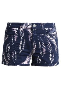 Námořnické modré šortky s vzorem palmového listu v růžové a bílé barvě. Vybavené předními kapsami, zapínáním na knoflíky a ohnutými lemy.