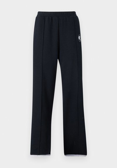 Black sweatpants with a relaxed fit, featuring an elastic waistband, side seams, and white lace trim at the hem. Made from soft fabric.