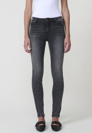Jeans ajustados en denim gris oscuro con un ligero efecto desgastado, que presentan un diseño de cinco bolsillos y un cierre de cremallera.