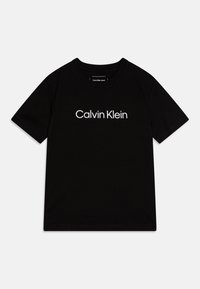 Black cotton t-shirt with short sleeves and a crew neck, featuring a white "Calvin Klein" logo printed across the chest.