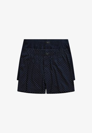 Marineblaue Boxershorts, eine einfarbig und eine mit weißen Punkten, mit elastischem Bund und Knopfverschluss, beide aus weichem Stoff gefertigt.