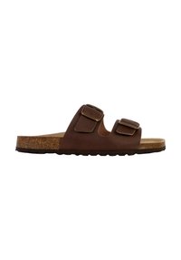 Sandale brune avec deux boucles réglables, semelle en liège et semelle en caoutchouc texturée. Design minimaliste avec bout ouvert et talon découvert.
