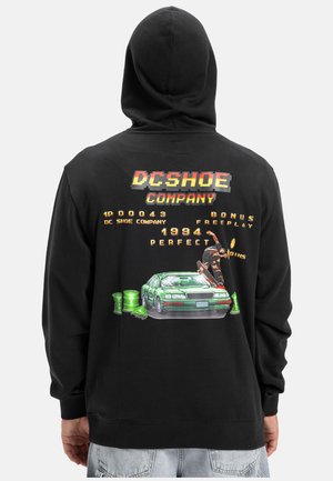 Black hoodie featuring a graphic of a green car with a skateboarder, retro text, and video game elements on the back. Soft fabric, casual design.