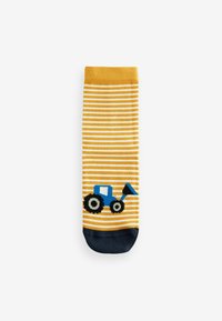 Gelb-weiße gestreifte Socke mit blauem Traktor-Design an der Sohle; hat einen navy-farbenen Bund und Zehen. Aus Baumwolle und in Standardform.