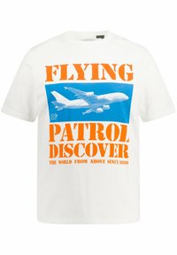 White cotton t-shirt featuring bold orange text: "FLYING PATROL DISCOVER." Graphic of an airplane in blue background. Short sleeves, relaxed fit.
