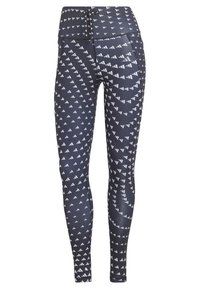 Leggings gemaakt van rekbare stof, met een donkerblauwe achtergrond en witte driehoekige patronen, hoge tailleband en een aansluitend ontwerp.