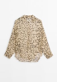Beige long-sleeve blouse with black irregular leopard print spots, buttoned cuffs, and a curved hem, shown from the back.