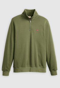 Olijfgroene ritsvest met hoge kraag. Bevat een klein rood Levi's-logo op de borst en ribgebreide manchetten en zoom. Zachte katoenen stof.