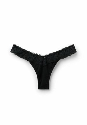 Zwarte thong van gladde stof met een brede kanten rand langs de tailleband, voorzien van intricat floral patroon en gegolfde randen.