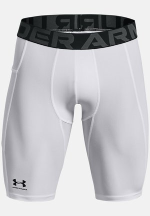 Pantalones cortos compresores blancos hechos de tejido elástico, con una cinturilla elástica negra que lleva el logo "UNDER ARMOUR", textura suave y diseño ajustado.