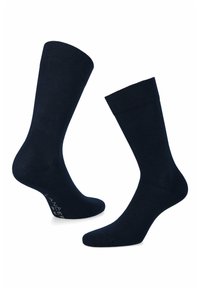 Granatowe skarpetki wykonane z miękkiego materiału, z prążkowanym mankietem i gładką fakturą, z subtelnym logotypem na podeszwie.