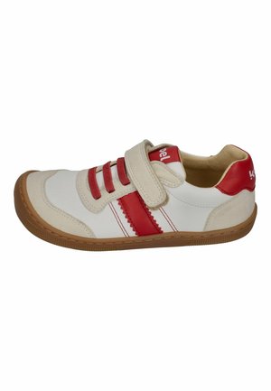 White and beige sneaker with red laces, red stripe on sides, red heel tab, beige velcro strap, and brown rubber sole.