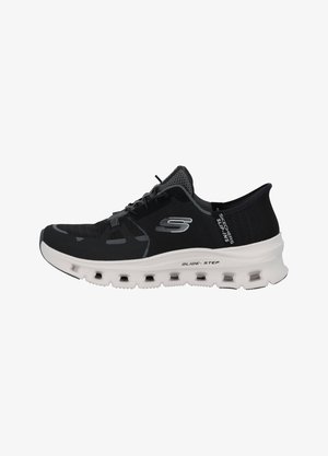 Black athletic shoe with a lightweight mesh upper, lace-up design, and cushioned white sole featuring cutouts for breathability.