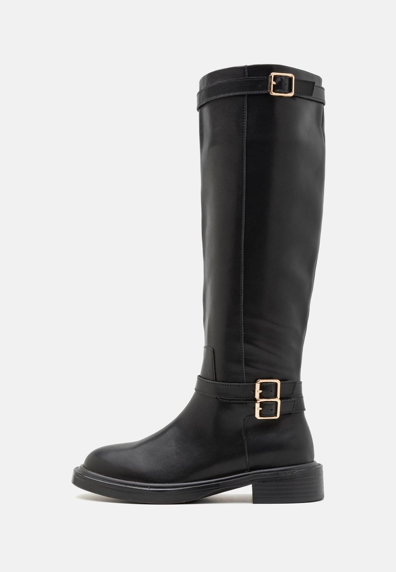 Black knee-high boots made of smooth leather with a rounded toe, a chunky heel, and dual gold buckle accents on the ankle strap.