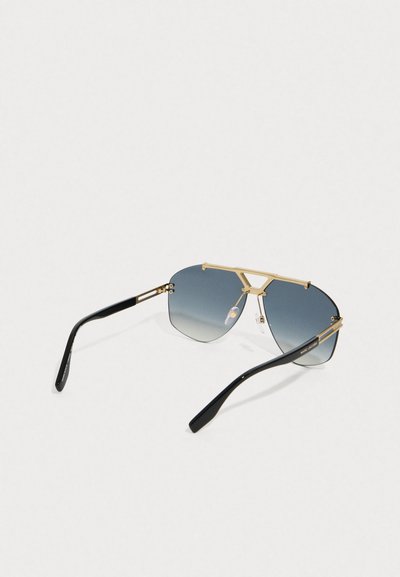 Sleek aviator sunglasses with blue gradient lenses, gold metal frame, and black temple arms, branded Marc Jacobs on the side.