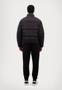 EA7 Emporio Armani GIUBBOTTO UNISEX - Ziemas jaka - black
