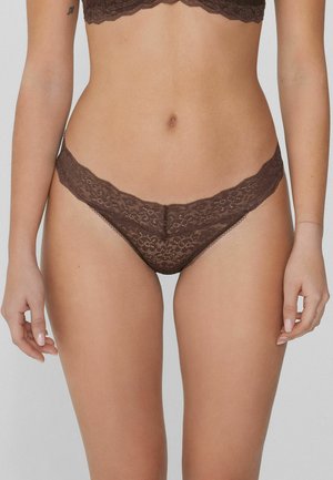 Braunes Spitzen-Tanga mit gewellten Kanten und Blumenmustern. Weiches Material, minimale Abdeckung. Geeignet als Unterwäsche.