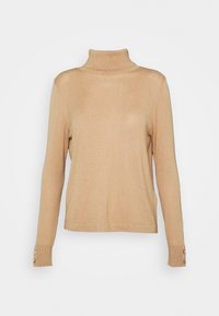 Beżowy sweter z golfem wykonany z miękkiego materiału, z długimi rękawami i guzikami przy mankietach, charakteryzujący się luźnym krojem i gładką teksturą.