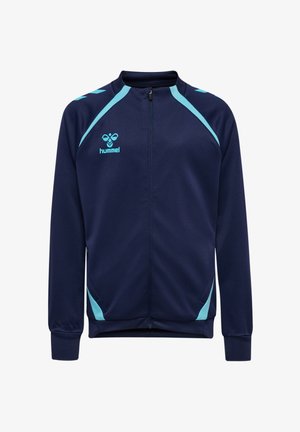 Marineblauwe sportjas met ritssluiting en lichtblauwe accenten op schouders en zakken, met het hummel-logo op de borst.