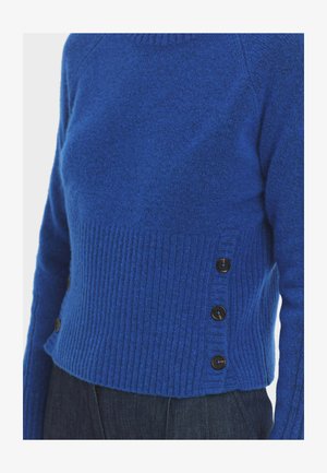 Blauer Wollpullover mit geripptem Design und seitlichen Knopfakzenten. Glatte Textur mit taillierter Silhouette und rundem Ausschnitt.