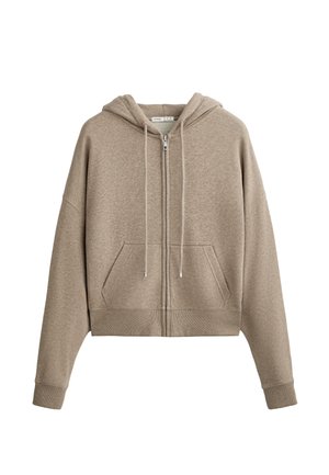 Beige zip-up hoodie with a drawstring hood, large front pockets, and a cropped cut. Made from cotton blend fabric with a smooth texture.