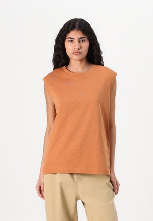 Orange sleeveless T-shirt made of soft fabric with a round neckline and a relaxed fit, featuring subtle texture and no visible accents.