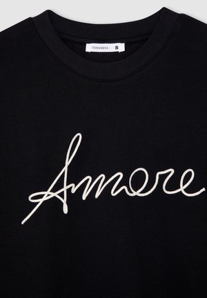 Felpa nera in cotone con collo a costine, caratterizzata da ricamo bianco in corsivo con la scritta "Amore" sul davanti. Tag della taglia visibile come S.