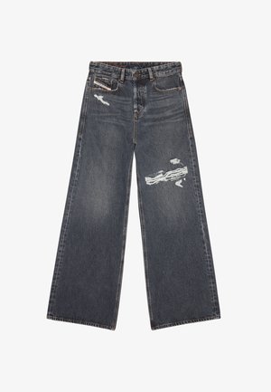 Jeans in denim scuro a gamba larga con strappi, caratterizzati da una vita alta, cinque tasche e cuciture a contrasto. Dettagli strappati sul davanti.