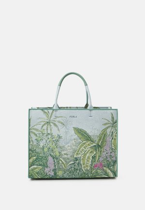 Rektangulær taske med grønne håndtag og et tropisk botanisk print med store blade og blomster på en lys baggrund.