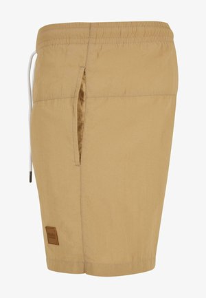 Vaaleanruskeat uimar shortsit kevyestä kankaasta, joissa on sivutasku, joustava vyötärö ja nauha, sekä suora logo-patch.