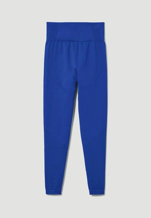 Leggings deportivos azules con una amplia cinturilla acanalada, patrones texturizados a lo largo de los lados y un diseño ajustado. Acabado en tela suave.