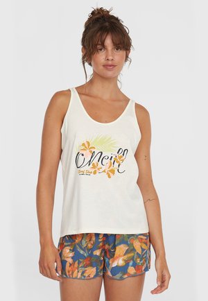 White tank top with floral graphic in orange and green; relaxed fit. Paired with colorful, patterned shorts featuring blue and orange hues.