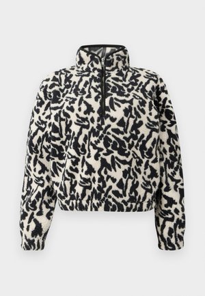 Pull en polaire ivoire avec motif abstrait noir, doté d'un col zippé à mi-hauteur et de poignets élastiques pour un ajustement confortable.