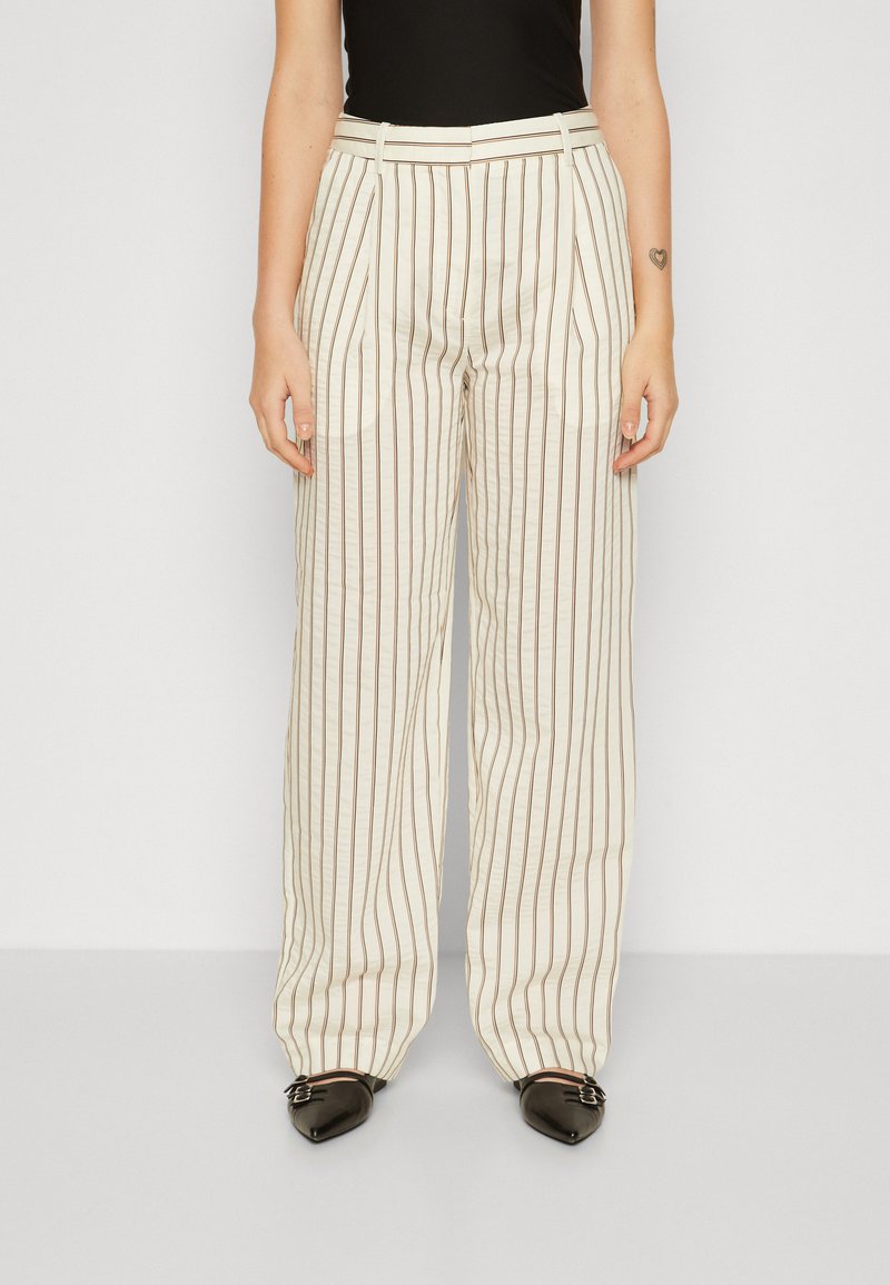 Lichtbeige wijde broek met bruine verticale strepen, met een hoge taille, zijzakken en een gladde textuur.