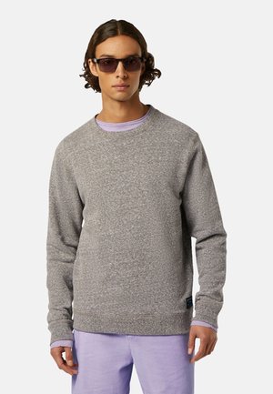 Gray sweatshirt with a textured finish, round neck, and ribbed cuffs, layered over a light purple shirt. Notable brand tag at the hem.