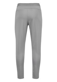 Graue Sportleggings mit glatter Textur, mittelhohem Bund und taillierter Passform. Sie zeichnen sich durch einen minimalistischen Stil ohne sichtbare Logos oder Muster aus.