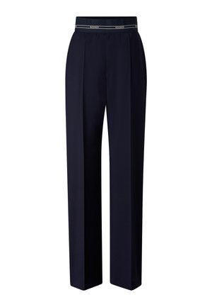 Navyblauwe, op maat gemaakte broek met rechte pijpen en elastische tailleband met het "BOGNER"-logo in het wit op een zwarte band.