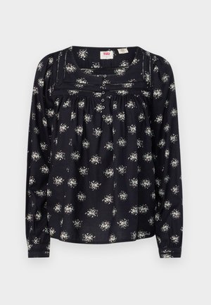 Must mustaga varrukatega pluus, millel on väikesed lillemustrid, nööbiga detailid ja volang rindkere piirkonnas. Pehme puuvillane materjal, mugav lõige.