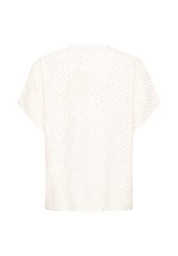 Blouse blanche à manches courtes avec petits pois rouges, affichée à plat sur un fond blanc, montrant le dos.