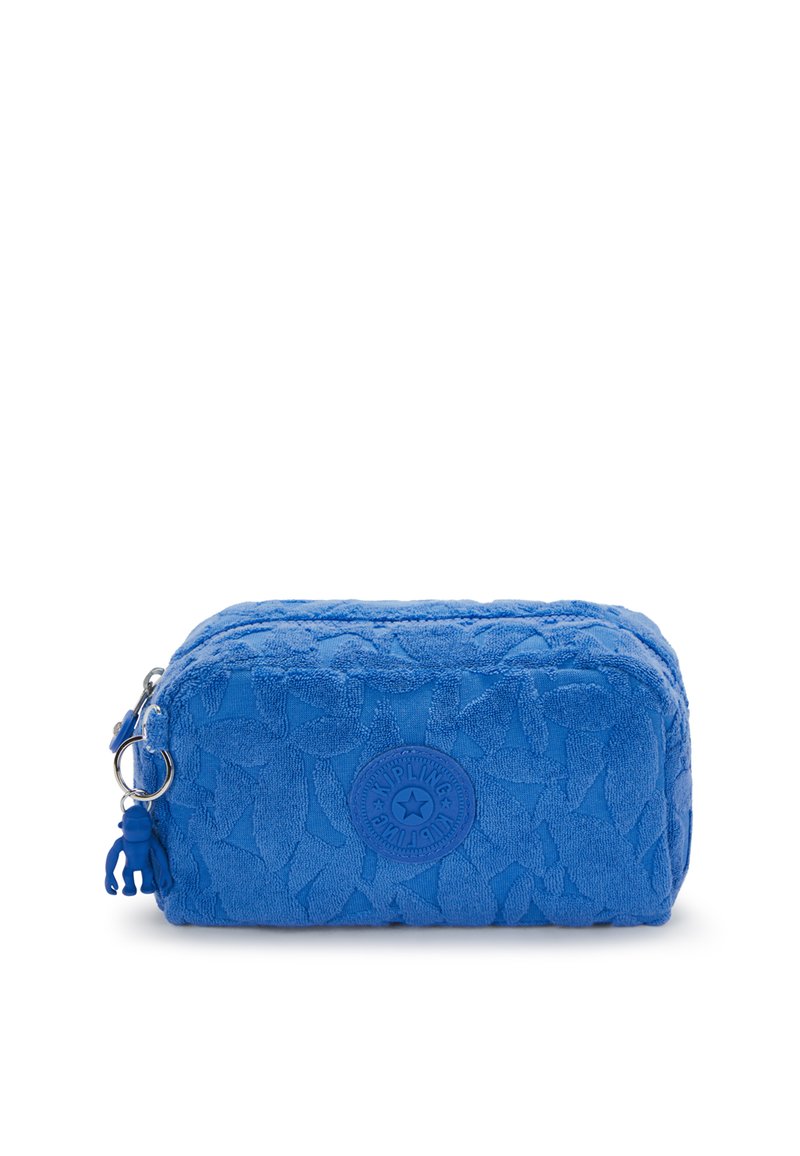 Borsa cosmetica rettangolare blu realizzata in tessuto testurizzato con un motivo a foglia. Presenta una chiusura con cerniera e un logo circolare sul davanti.