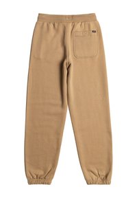 Beige joggers dengan pinggang elastis, ujung yang dicuff, dan kantong belakang berbentuk persegi panjang dengan detail jahitan.