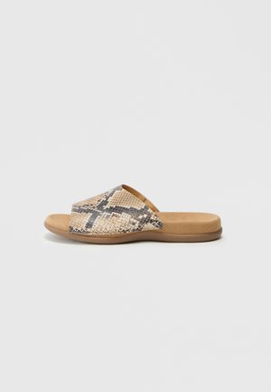 Slide sandal with a textured, tan base and a patterned upper featuring shades of beige, brown, and black resembling snake skin.