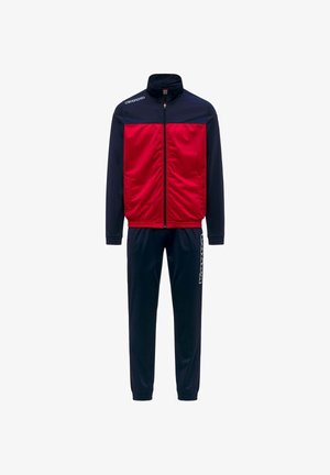 Survêtement avec manches et pantalons bleu marine, panneau avant rouge de la veste, fermeture éclair complète et texte de logo blanc sur l'épaule et la jambe du pantalon.