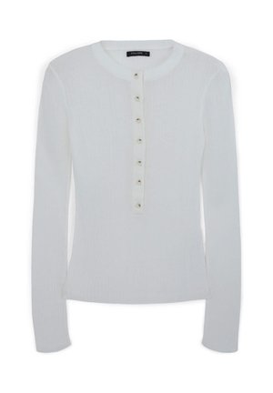 Weißes langärmeliges, geripptes Oberteil mit runder Ausschnitt und sieben kleinen Knöpfen in der Mitte der Vorderseite.