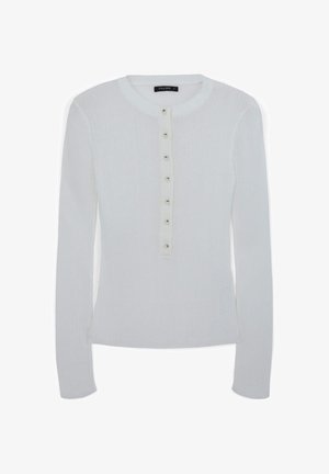 Weißes langärmeliges, geripptes Oberteil mit runder Ausschnitt und sieben kleinen Knöpfen in der Mitte der Vorderseite.