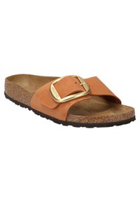 Tan suede slide sandal with a wide strap featuring a gold metal buckle, a contoured cork footbed, and a textured rubber sole.