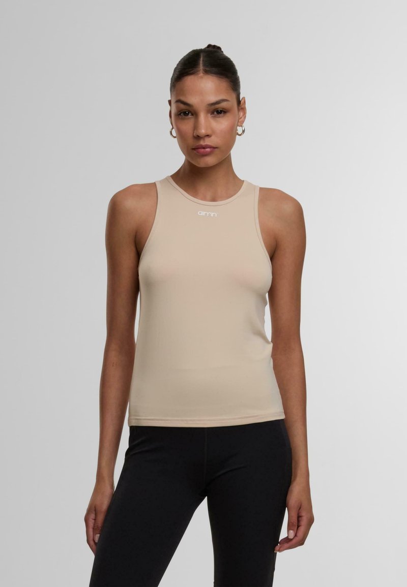 Nacktes ärmelloses Tanktop mit Rundhalsausschnitt, aus dehnbarem Material, mit einem kleinen weißen Logo auf der Vorderseite.